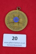 A German veterans’ association 50-year jubilee medallion, gilt-finish with enamelled central