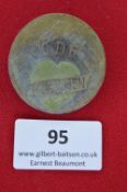 A German Third Reich KdF Badge, circular pressed card issue with 