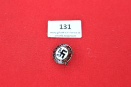 An NSDAP Membership Badge, small circular alloy and enamel example bearing a black swastika within