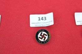 “Heim ins Reich” enamel badge, black border with central swastika.
