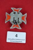 A German WWII Red Cross decoration, 2nd Class for men, in silvered metal with red enamel cross