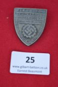 A German Labour Procurement commemorative badge, shield-form silvered metal issue inscribed “