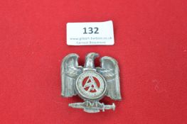 A 1935 SA Treffen Day Badge, die-stamped eagle perched upon a sword and wreath enclosing “SA Treffen