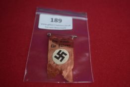 German political rally day ribbon badge, red cloth printed with slogan “Ein Volk, Ein Reich, Ein