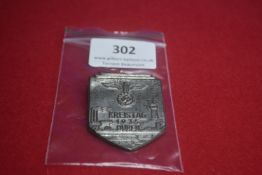 Pressed Tin Commemorative Badge “Kreistag 1935 Düren” – A shield-shaped grey finished pressed tin