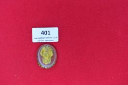 Glass Portrait Plaque of Ludwig van Beethoven – An oval-shaped translucent yellow-green glass