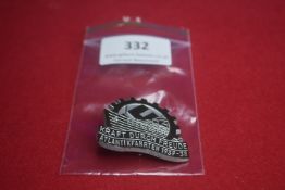 Kraft Durch Freude Atlantikfahrten 1937–38 Badge – A cogwheel-shaped pressed metal badge featuring