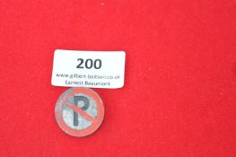 Vintage enamel badge, circular, showing 