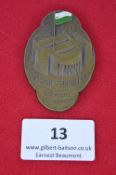 A Saxon Gymnastics Festival commemorative badge, oval bronze issue embossed with stadium and flag,