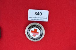 Enamel Red Cross Badge – A circular enamel badge of the Deutsches Rotes Kreuz, inscribed