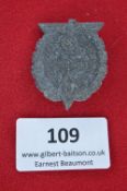 A 1937 Hitlerjugend rally badge, grey zinc alloy issue, in the form of a wreath with eagle and