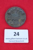 A German BDM (League of German Girls) membership or rally badge, circular grey alloy issue with