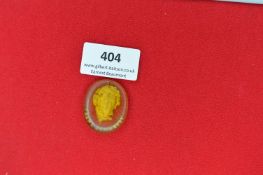 Glass Portrait Plaque of Franz Schubert – An oval-shaped translucent amber glass plaque, moulded