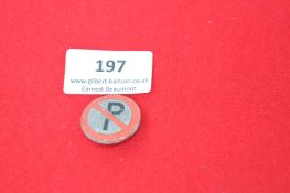 Vintage enamel badge, circular, featuring a 