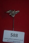 A silvered stickpin badge in the form of a Luftwaffe eagle clutching swastika. Reverse stamped