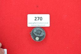 A German WWII-era membership badge, zinc construction. Reverse marked 