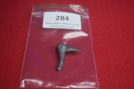 Cast Metal Commemorative Tinnie Badge in the form of a Pick Axe – A grey-metal badge designed as a