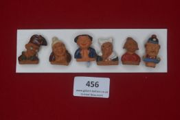 Collection of six German WWII terracotta caricature badges — Humorous busts of named characters