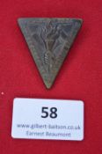 A German Third Reich Day Badge, triangular bronze alloy issue for the 1st Anniversary of the