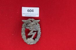 Luftwaffe Ground Assault Badge (Erdkampfabzeichen der Luftwaffe) – A silvered, die-cast badge,