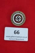 A German Third Reich NSDAP Golden Party Badge, gilt bronze and enamel issue with oakleaf wreath