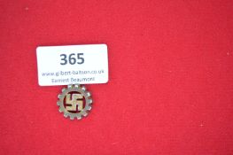 Deutsche Arbeitsfront Cogwheel Badge – A small gilt metal badge in the form of a cogwheel with