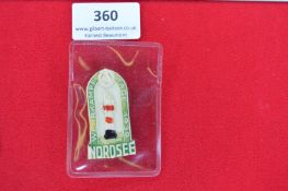 Wehrkampftage Nordsee 1939 Badge – A pressed and enamelled tin badge in arched form, with lighthouse