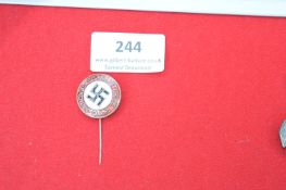 Early Party Membership Stickpin Badge – A circular enamel stickpin badge with red border