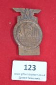 A German Third Reich NSBO Day Badge, pressed metal issue for 1. Tagung Deutsch Arbeitsfront Bez.