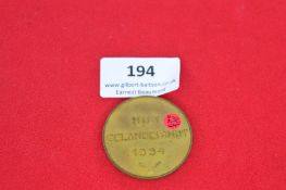 German bronze medal, obverse with eagle-and-swastika emblem, shield and legend “Dem Sieger”, reverse