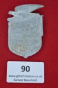 A German Third Reich Day Badge, silvered pressed alloy issue commemorating 10 Years of Struggle, Gau