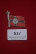 WHW miniature flag badge in celluloid plastic depicting the red Kriegsmarine battle flag with