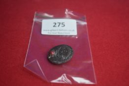 A German WWII-era membership badge, zinc construction. Reverse marked with date and maker’s code.