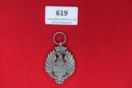 Imperial German Eagle Medal – A silvered medal featuring a crowned German eagle clutching a
