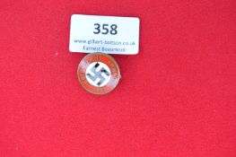 Deutschland Erwache Badge, 1933 – A circular enamel badge with red border inscribed Deutschland