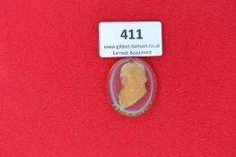 An oval glass pendant with gilt bust portrait of Freiherr vom Stein (variation of Lot 409).