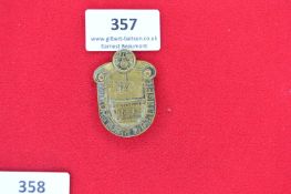 NSKK Motorsporttag Lingen 1938 Badge – A shield-shaped pressed brass badge with depiction of