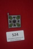 WHW miniature tinnie badge in the form of a German regimental standard, enamelled in green, black,