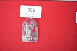 NSKOV Treffen Oldenburg 1935 Badge – A pointed-arch shaped pressed metal badge with red enamel