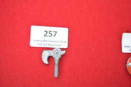 Pressed Metal Badge in the Form of a Fasces – A grey pressed metal badge in the form of a Roman