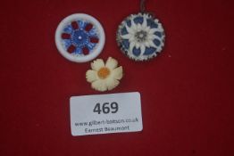 A group of three German WWII WHW porcelain floral day badges, polychrome decorated examples