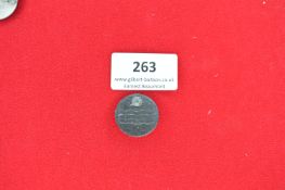 Circular Metal Commemorative Badge “Februar” – Another circular pressed metal badge with raised