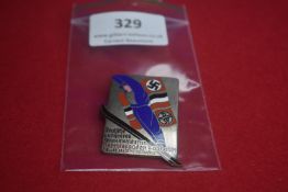 Coloured Enamel Ski Championship Badge – A rectangular metal and enamel badge depicting skier in