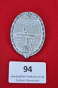 A German Third Reich Day Badge, oval alloy issue for Frontsoldaten und Kriegsopfer Ehrentag, Kiel