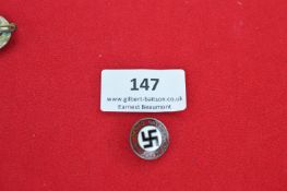 N.S.D.A.P. party membership badge, standard circular form with red and white enamel, central black