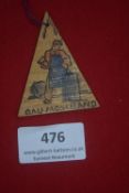 A German WWII WHW painted wooden triangular day badge, printed with a blacksmith at work,