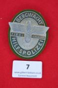 A German WWII Bergwacht Hilfspolizei (Mountain Rescue Auxiliary Police) badge, oval alloy