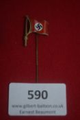 An enamelled stickpin in the form of a red party flag bearing a black swastika on white roundel.