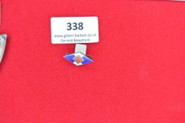 Enamel Party Badge – A small diamond-shaped enamel badge with red swastika on white field over