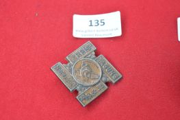A Nazi Party Day badge, bronze-coloured pressed tin issue in the form of a cross with central